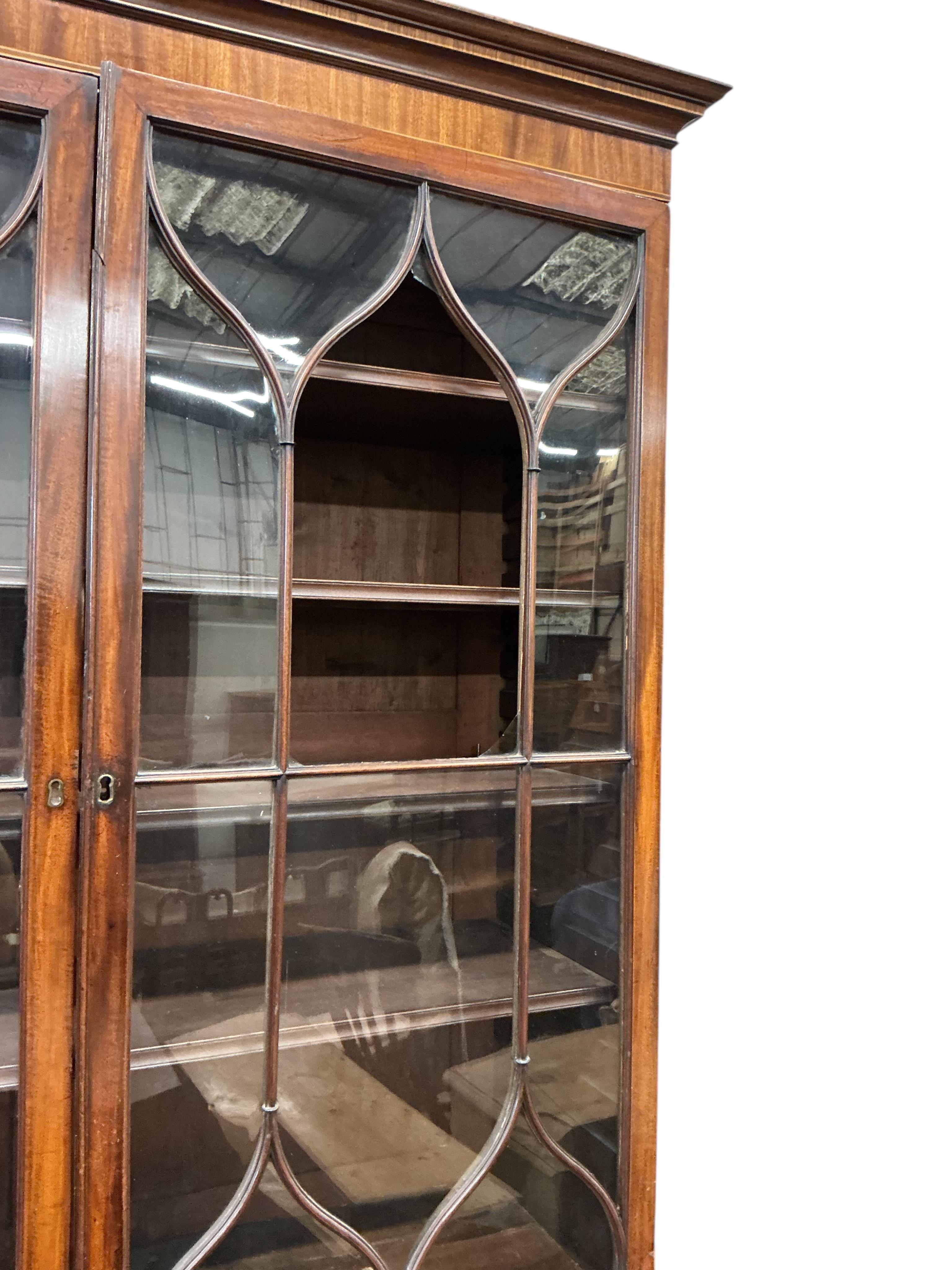 A George III mahogany secretaire bookcase, width 116cm, depth 57cm, height 234cm, one glass pane missing